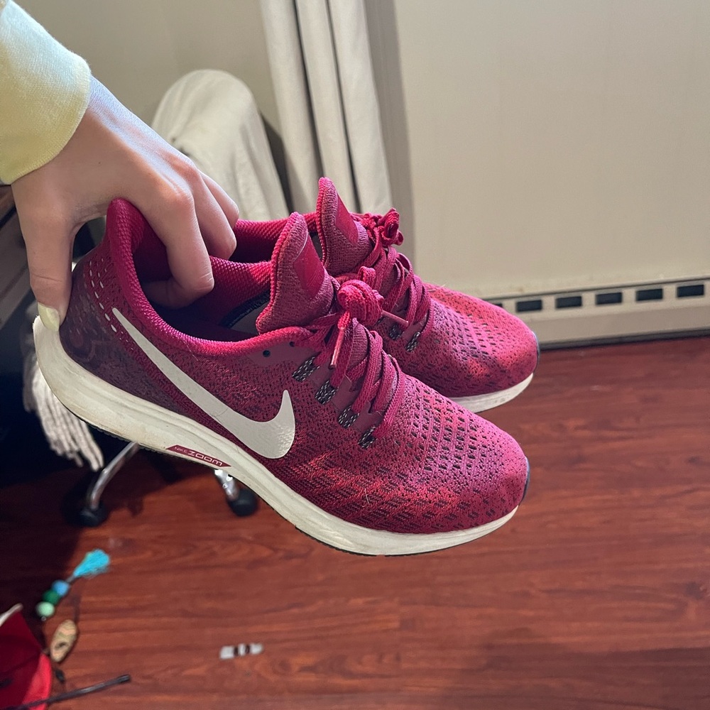 Red Nike women’s running shoes